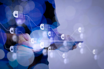 Double exposure of businessman hand using Tablet computer with colour cloud concept