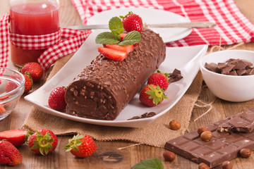 Chocolate roll with strawberries. 