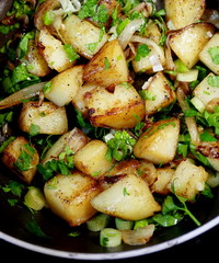 Potato side dish with onions and parsley.