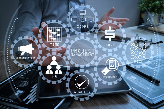 businessman working with digital tablet computer and smart phone and laptop computer with financial business strategy layer effect on wooden desk,filter effect