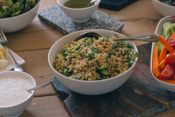 Green salad with vegetables on the wood table