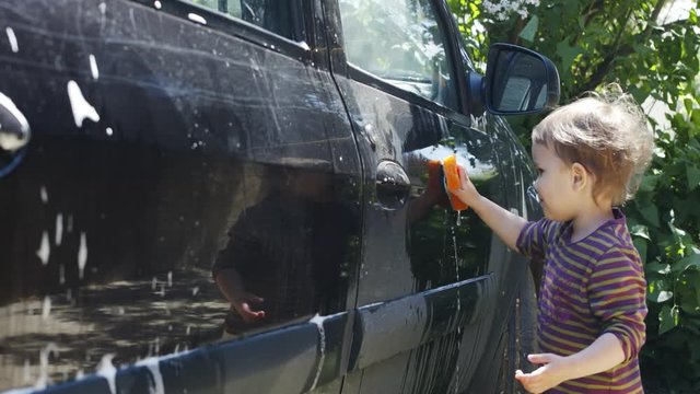 Slow Motion Of Chil Help To Young Man Wash Sponge His Car