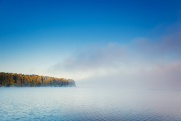 Vivid view of the foggy pond in morning. Location place Ternopil, Ukraine, Europe.