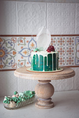 Naked wedding birthday cake. Rustic layer homemade cake with cream. Dessert decorated with chocolate and fruits. Selective focus. 