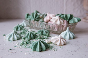 Meringue dessert. Freshly baked sweets made of eggs and sugar. Crispy cookies. Bright colors