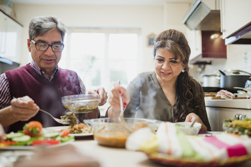 Mature Couple Enjoying Dinner at Home