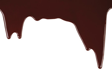 Melted chocolate dripping on white background