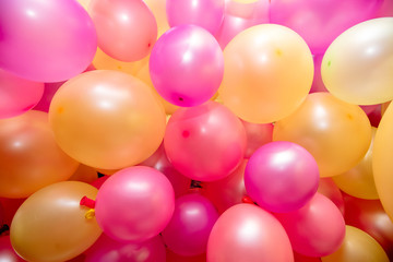 Fototapeta na wymiar Aerial view of a colorful background birthday balloons, closeup.
