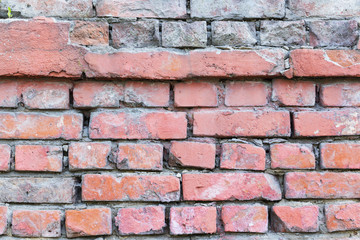 red brick wall texture grunge background with vignetted corners, may use to interior design.