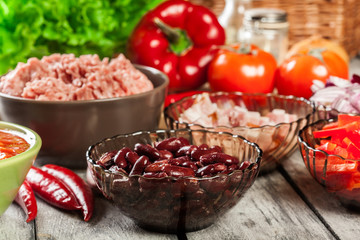 Ingredients ready for preparing chili con carne. Mincemeat, papr
