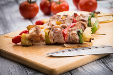 Close up Mouth Watering Gourmet Barbecue on Wooden Chopping Board at the Table