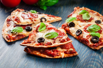 Slices of pizza pepperoni with olives