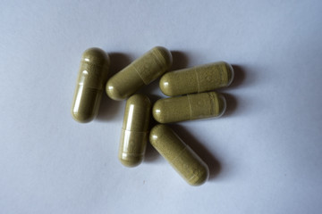 Top view of six capsules of moringa