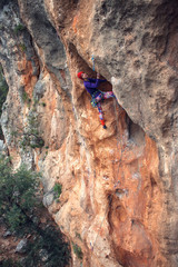 A rock climber on a rock.