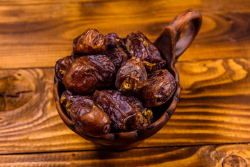 Date fruits on the rustic wooden table