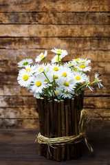 Daisy flowers in a wicker vase