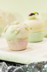 Homemade topping sweet wedding cupcake./ Homemade sweet beauty flower and topping decoration on wedding cupcake.