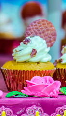 Homemade topping sweet wedding cupcake./ Homemade sweet beauty flower and topping decoration on wedding cupcake.