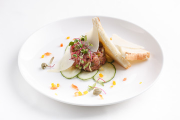 veal tartare appetizer on the plate. close up.