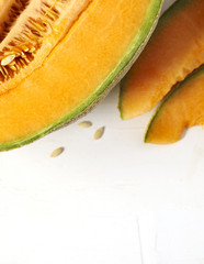 Fresh sweet cantaloupe melon on the white background.