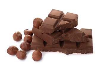 Delicious milk chocolate with nuts on white background