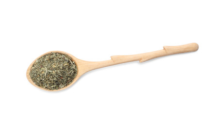Spoon with dried parsley on white background, top view
