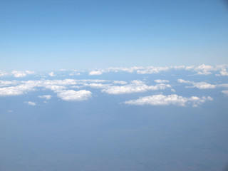Blue sky with clouds, a view from airplane window