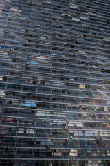 Vertical view of an office building with rectangular glass windows