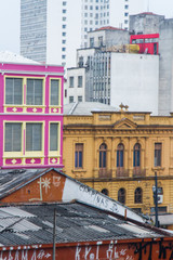Colorful facades of old and aged business buildings