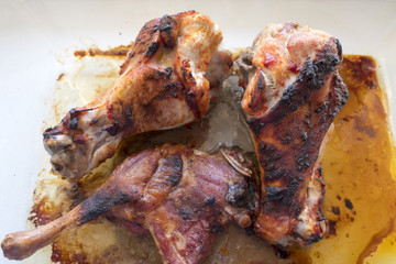 Appetizing grilled turkey shanks and chicken legs