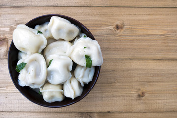 Appetizing traditional Russian dumplings with meat close-up and copy space