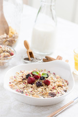 Sunny Morning with Healthy Breakfast. Muesli With Milk, Chia Seeds, Berries and Cinnamon.