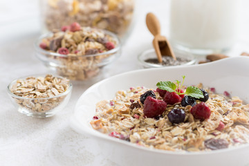 Sunny Morning with Healthy Breakfast. Muesli With Milk, Chia Seeds, Berries and Cinnamon.