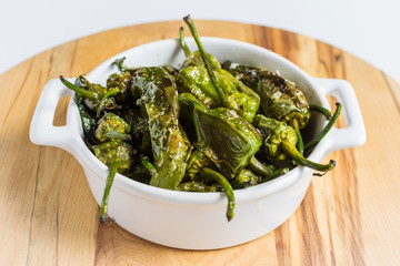 Pimientos de Padron. Padron Green Peppers in White Bowl.