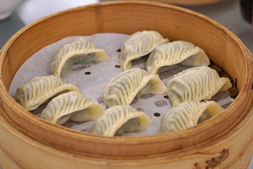 Xiaolongbao - Chinese Soup Dumplings serve on bamboo steaming basket