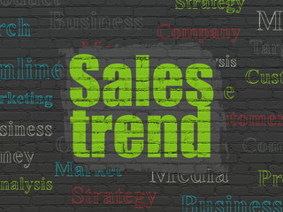 Advertising concept: Painted green text Sales Trend on Black Brick wall background with  Tag Cloud