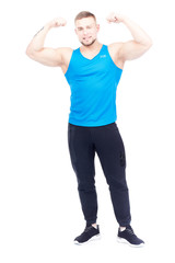 Portrait of strong athletic man in sports clothes posing on white background