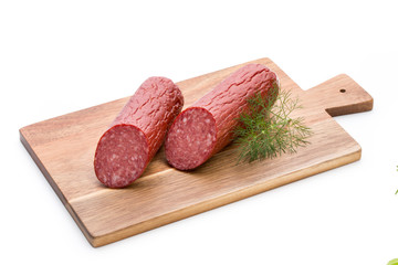 Salami smoked sausage, basil leaves on white background cutout.