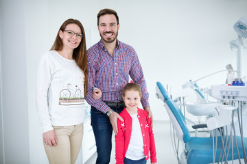 Dentist with sterile mask and dental instruments held exam teeth of patient