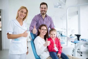 Dentist with sterile mask and dental instruments held exam teeth of patient