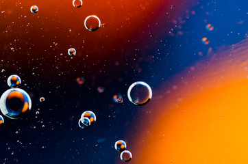 Oil drops on water surface abstract background