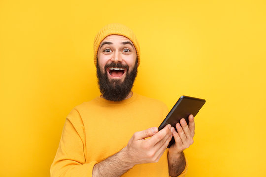 Happy guy with modern tablet