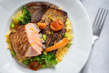 Grilled Salmon Steak with Vegetables on White Plate. Healthy Food.