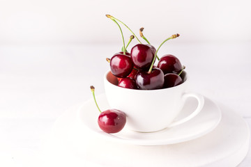 Fresh and Beautiful Cherry in a White Cup Ripe Juicy Cherry White Background