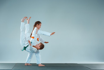 The boy fighting at Aikido training in martial arts school. Healthy lifestyle and sports concept
