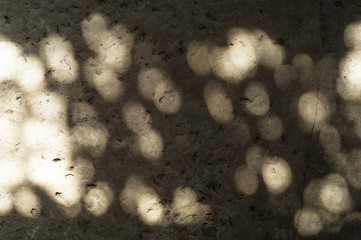 Solar patches of light on stone surface