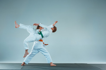 The boy fighting at Aikido training in martial arts school. Healthy lifestyle and sports concept