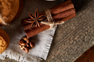 Traditional Christmas tea concept with anise , cookies and decorations on a wooden table, selective focus