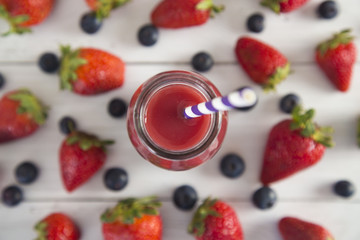 Berry Fruit Smoothy on a White Wood Table