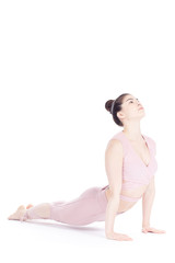 Obraz premium Young woman, professional yoga instructor practicing asanas isolated on white